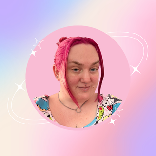 Laura, a femme presenting person with bright pink hair tied up, surrounded by pink and purple gradient